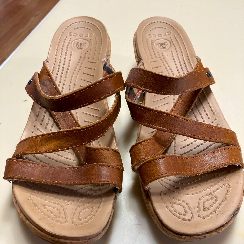 Croc Sandals, size 9, tan leather uppers with clothe backing and cork soul.